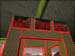 The monitors feed with bounding boxes turned on. If you look closely, you can see the players box beside the hut at the top