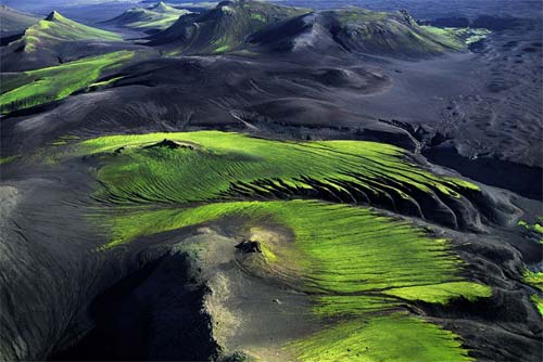 Green lichen on otherwise barren volcanic mountainside in Iceland